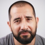 Photo of a 30-year-old American and European man,Taken with a Canon EOS R5 camera,Be very close to human reality,with high detail،portrait,No cinematic effect ,background to white