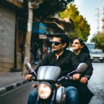 عکس تولید که از زوج جوان ایرانی سوار بر موتور در خیابان های تهران